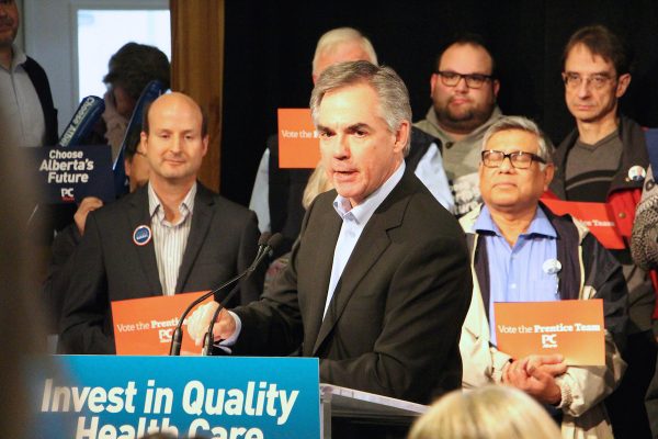 Jim Prentice speaks at the podium of his campaign rally on April 14, 2015.
