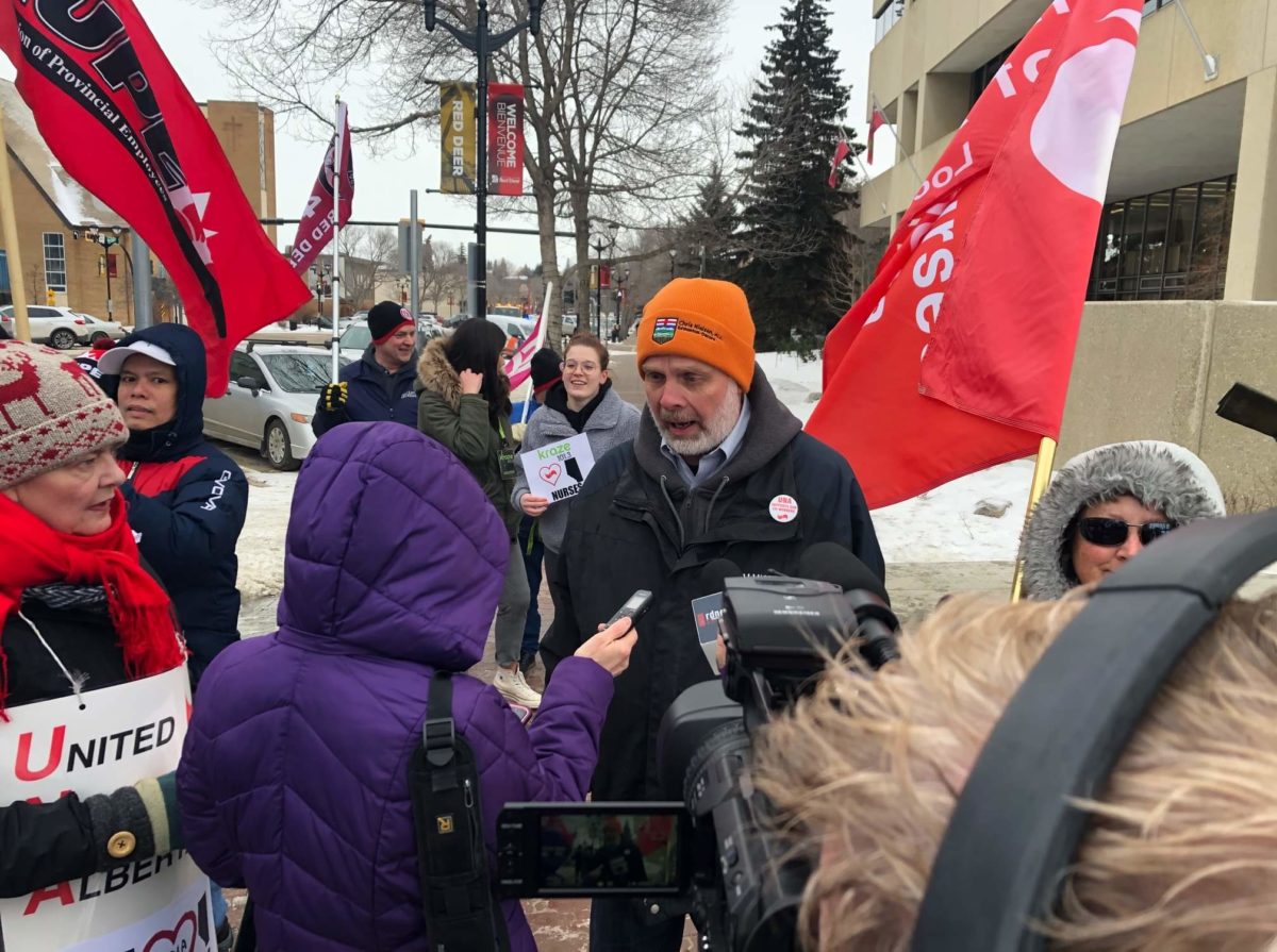 Edmonton-Decore MLA Chris Nielsen (center) at a demonstration with members of United Nurses of Alberta