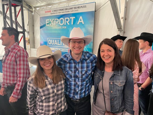 Danielle Smith poses with federal Conservative frontrunner Pierre Poilievre at a Calgary Stampede event.