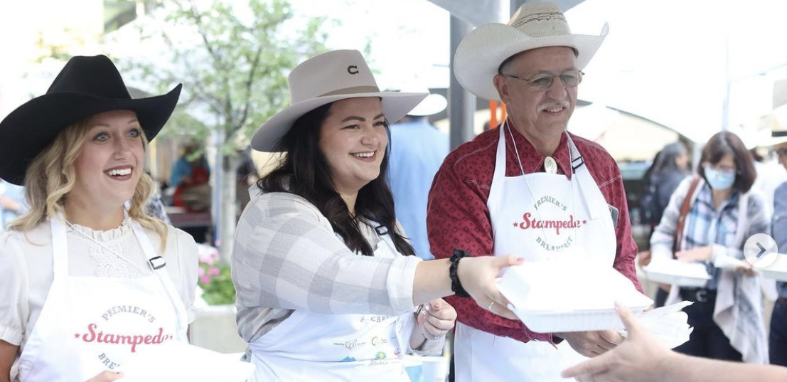 Michaela Frey (centre) with fellow UCP MLAs Miranda Rosin (left) and Ron Orr (right) at the Calgary Stampede in 2022.