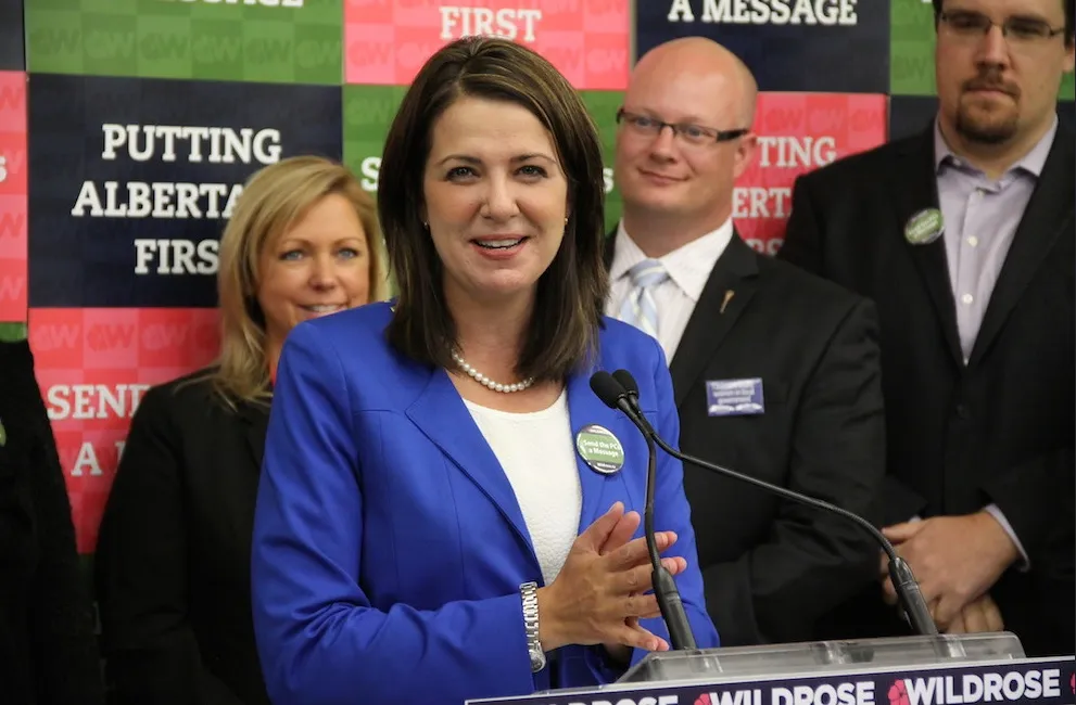 Then-leader of the Wildrose Party Danielle Smith at a press conference during the 2014 Edmonton-Whitemud by-election. Newly nominated Wildrose candidate Jason Nixon is standing on the right side of the photo. (source: Dave Cournoyer)