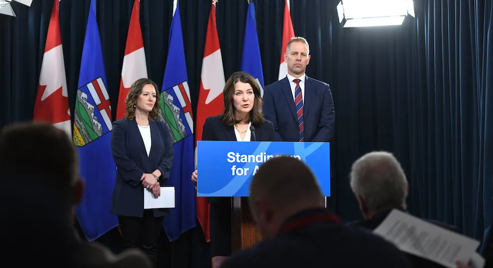 Premier Danielle Smith (centre) at a November 27, 2023 press conference with Minister of Environment and Protected Areas Rebecca Schulz (left) and Minister of Affordability and Utilities Nathan Neudorf (right). (source: Alberta Newsroom / Flickr)