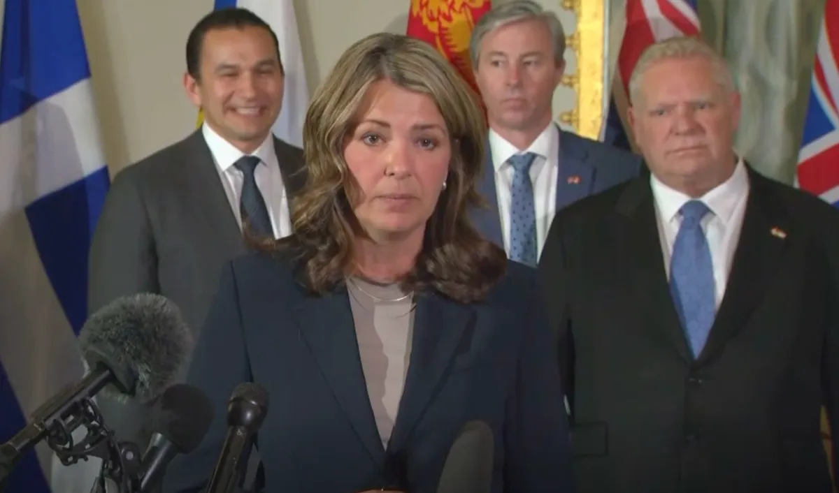 Alberta Premier Danielle Smith speaks to reporters in Washington DC on February 12, 2025. Standing behind her are Manitoba Premier Wab Kinew, Nova Scotia Premier Tim Houston, and Ontario Premier Doug Ford (screenshot CPAC)